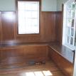 Built in wood wall paneling and benches